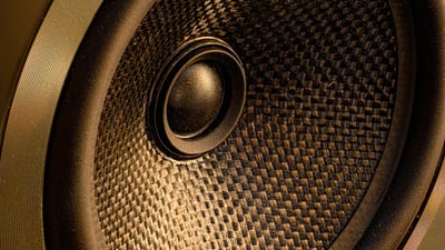 Close up closeup detail shot of a speaker cone. Loudspeaker design and performance concept