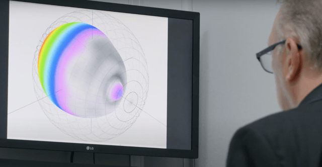 speaker designer reviewing speaker specs on computer, like q factor of a speaker and resonance